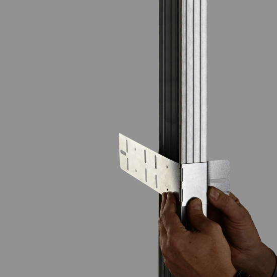 While holding the TraFLEX Clamp securely, begin to fold around the C-Profile ...