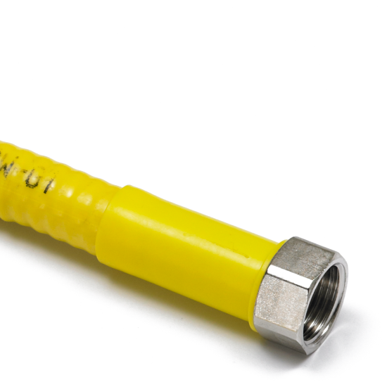 After fitting a sealing washer and tightening the nut onto the opposing fitting, slide the protective sleeve forward to protect the bare pipe.